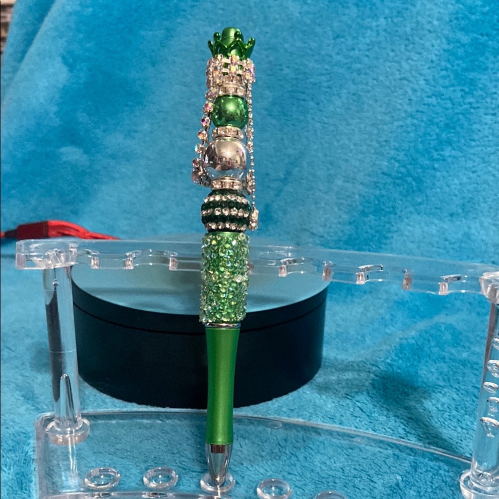 Green and Silver Decorative Pen with a beautiful crown.
